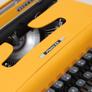 Olivetti Lettera 22 aka Pluma 22 Yellow Working Typewriter - shopcurious